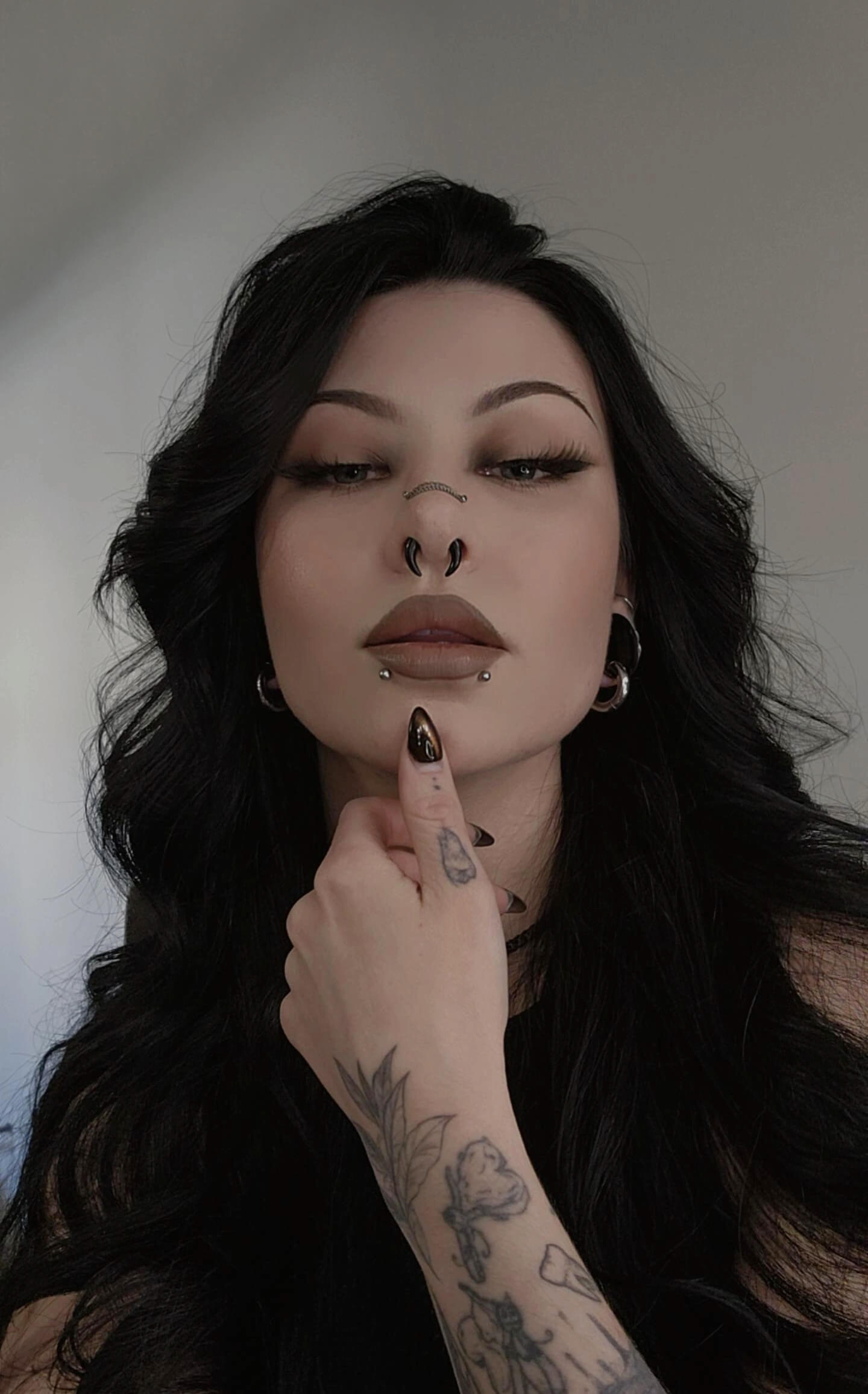 img of the makeup artist with black hair and makeup.